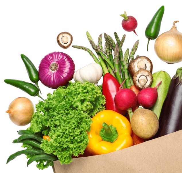 grocery bag with vegetables falling out